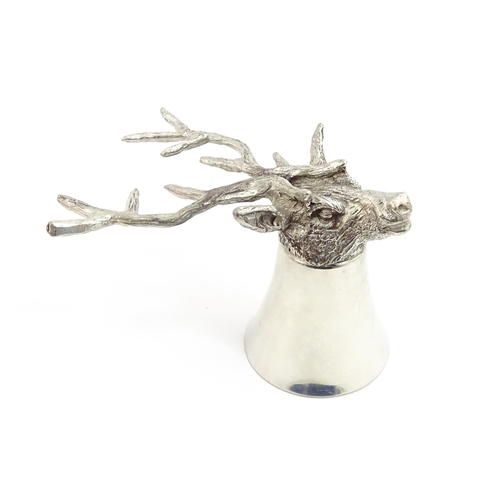 1312 - A 20thC novelty stirrup cup of tapering form modelled as a stag head with antler supports. Approx. 3... 