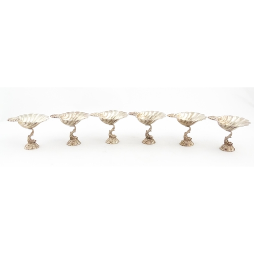 1314 - A set of six 20thC silver plate bon bon dishes with scallop shell bowls raised on dolphin / fish sup... 