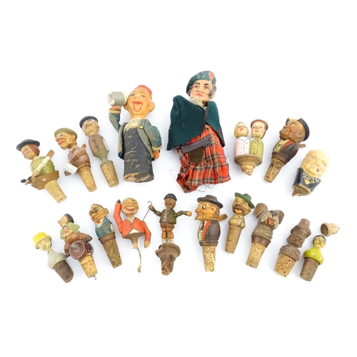 1316 - A quantity of 20thC Continental carved and composite novelty bottle stoppers to include figures and ... 