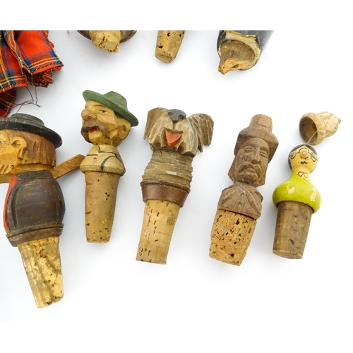 1316 - A quantity of 20thC Continental carved and composite novelty bottle stoppers to include figures and ... 