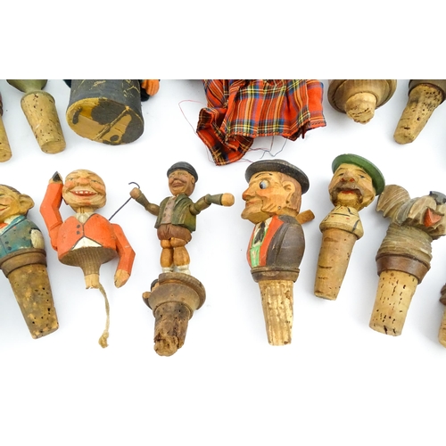 1316 - A quantity of 20thC Continental carved and composite novelty bottle stoppers to include figures and ... 