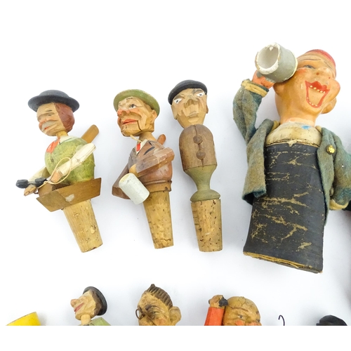 1316 - A quantity of 20thC Continental carved and composite novelty bottle stoppers to include figures and ... 