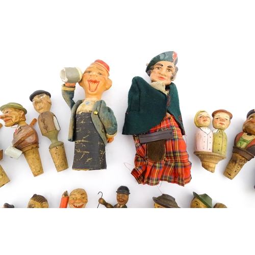 1316 - A quantity of 20thC Continental carved and composite novelty bottle stoppers to include figures and ... 