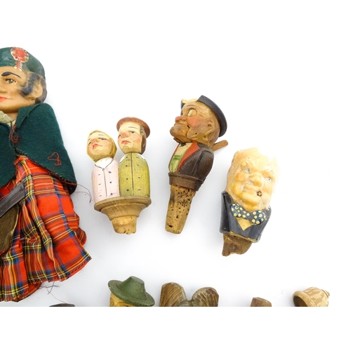 1316 - A quantity of 20thC Continental carved and composite novelty bottle stoppers to include figures and ... 