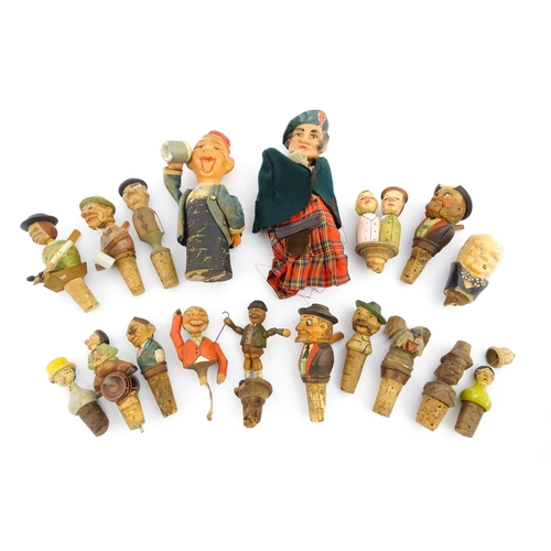 1316 - A quantity of 20thC Continental carved and composite novelty bottle stoppers to include figures and ... 