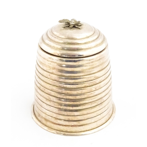 1321 - A 20thC silver plate candle holder with bee finial modelled as a skep / beehive by Kenneth Turner. A... 