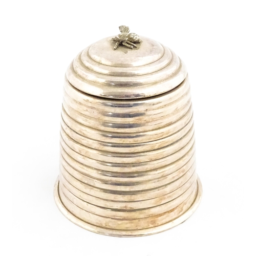 1321 - A 20thC silver plate candle holder with bee finial modelled as a skep / beehive by Kenneth Turner. A... 