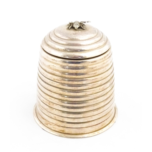 1321 - A 20thC silver plate candle holder with bee finial modelled as a skep / beehive by Kenneth Turner. A... 