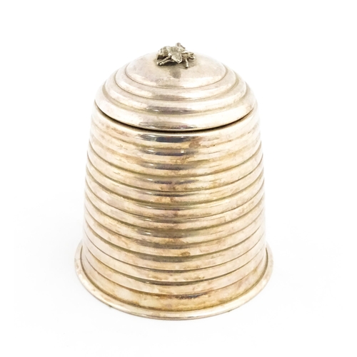 1321 - A 20thC silver plate candle holder with bee finial modelled as a skep / beehive by Kenneth Turner. A... 