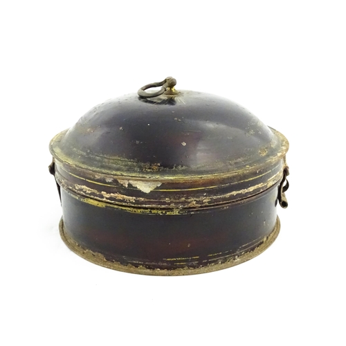 1326 - A Victorian toleware spice box of circular form with gilt detail, opening to reveal six sections wit... 