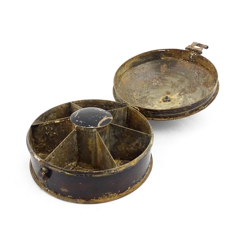 1326 - A Victorian toleware spice box of circular form with gilt detail, opening to reveal six sections wit... 