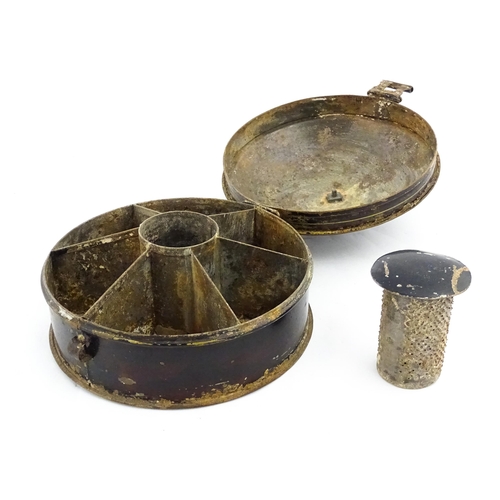 1326 - A Victorian toleware spice box of circular form with gilt detail, opening to reveal six sections wit... 