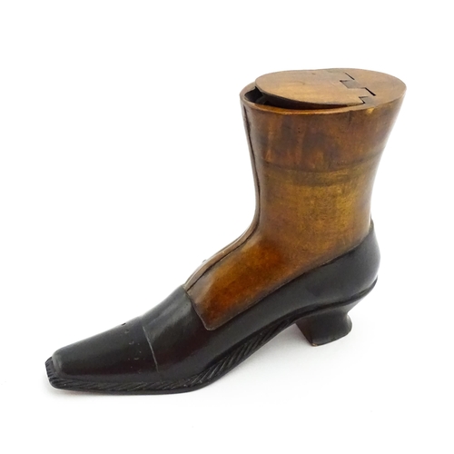 1346 - Treen : A large 20thC shoe snuff box / table snuff of boot form with hinged lid and carved decoratio... 