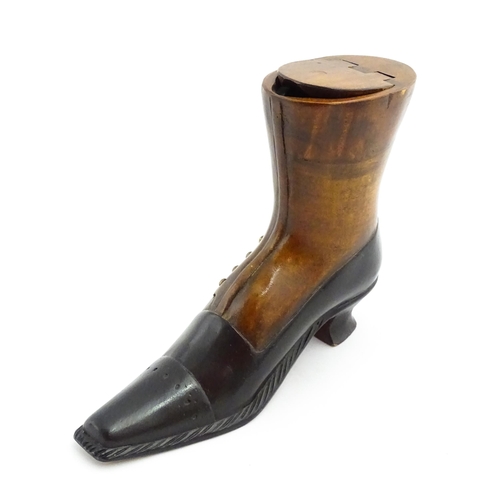 1346 - Treen : A large 20thC shoe snuff box / table snuff of boot form with hinged lid and carved decoratio... 