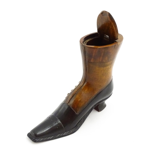 1346 - Treen : A large 20thC shoe snuff box / table snuff of boot form with hinged lid and carved decoratio... 