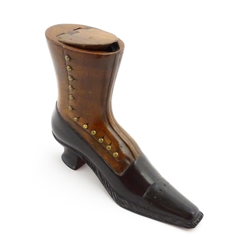 1346 - Treen : A large 20thC shoe snuff box / table snuff of boot form with hinged lid and carved decoratio... 