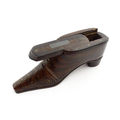 1349 - Treen : A 19thC shoe snuff box with sliding lid and inlaid brass studwork decoration. Approx. 4 1/4