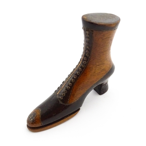 1350 - Treen : A 19thC shoe snuff box of heeled boot form with hinged lid to toe of boot and having studwor... 