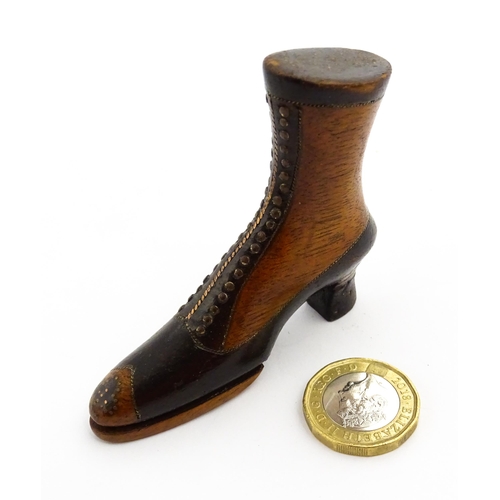 1350 - Treen : A 19thC shoe snuff box of heeled boot form with hinged lid to toe of boot and having studwor... 