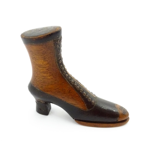 1350 - Treen : A 19thC shoe snuff box of heeled boot form with hinged lid to toe of boot and having studwor... 