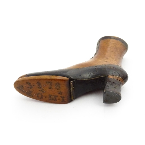 1350 - Treen : A 19thC shoe snuff box of heeled boot form with hinged lid to toe of boot and having studwor... 