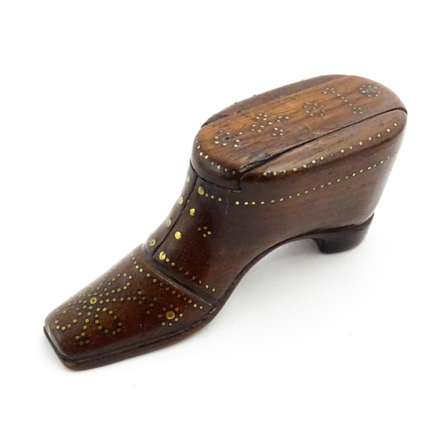 1351 - Treen : A 19thC shoe snuff box with sliding lid and inlaid brass studwork decoration. Approx. 3 1/2