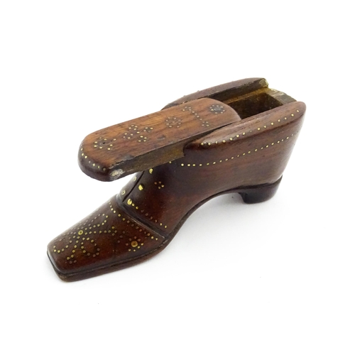 1351 - Treen : A 19thC shoe snuff box with sliding lid and inlaid brass studwork decoration. Approx. 3 1/2