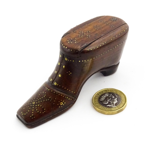 1351 - Treen : A 19thC shoe snuff box with sliding lid and inlaid brass studwork decoration. Approx. 3 1/2