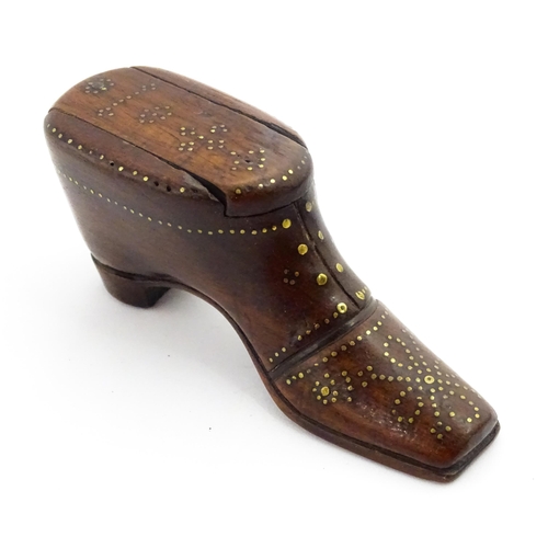 1351 - Treen : A 19thC shoe snuff box with sliding lid and inlaid brass studwork decoration. Approx. 3 1/2