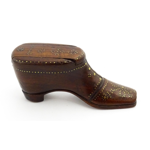 1351 - Treen : A 19thC shoe snuff box with sliding lid and inlaid brass studwork decoration. Approx. 3 1/2