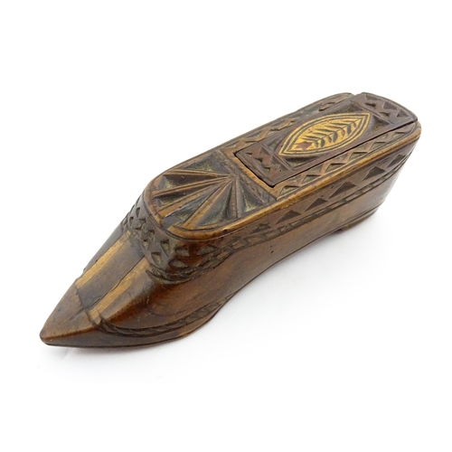 1352 - Treen : A large 19thC shoe snuff box with sliding lid, and chip carved decoration with foliate motif... 