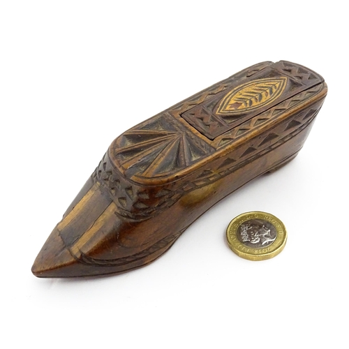 1352 - Treen : A large 19thC shoe snuff box with sliding lid, and chip carved decoration with foliate motif... 