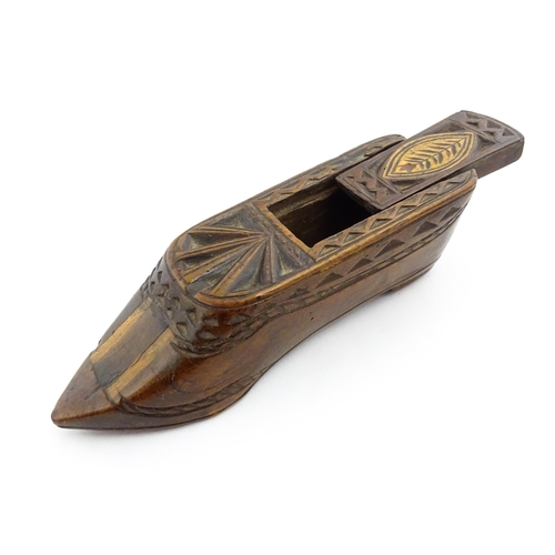 1352 - Treen : A large 19thC shoe snuff box with sliding lid, and chip carved decoration with foliate motif... 