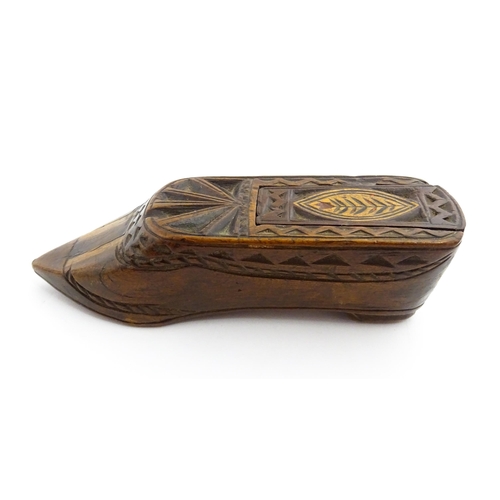 1352 - Treen : A large 19thC shoe snuff box with sliding lid, and chip carved decoration with foliate motif... 