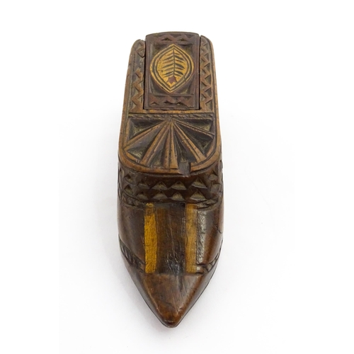 1352 - Treen : A large 19thC shoe snuff box with sliding lid, and chip carved decoration with foliate motif... 