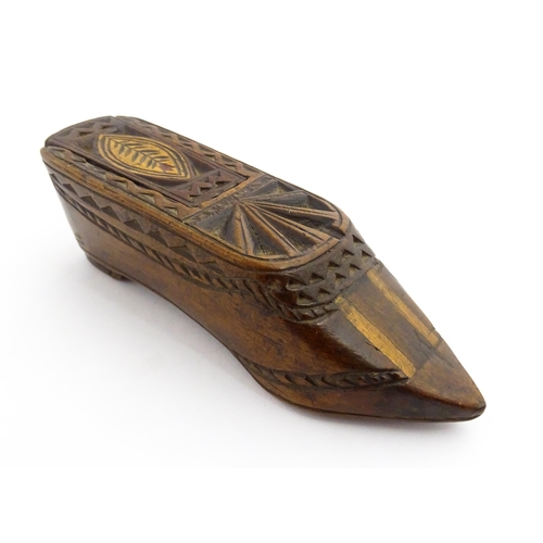 1352 - Treen : A large 19thC shoe snuff box with sliding lid, and chip carved decoration with foliate motif... 