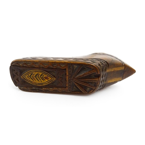 1352 - Treen : A large 19thC shoe snuff box with sliding lid, and chip carved decoration with foliate motif... 