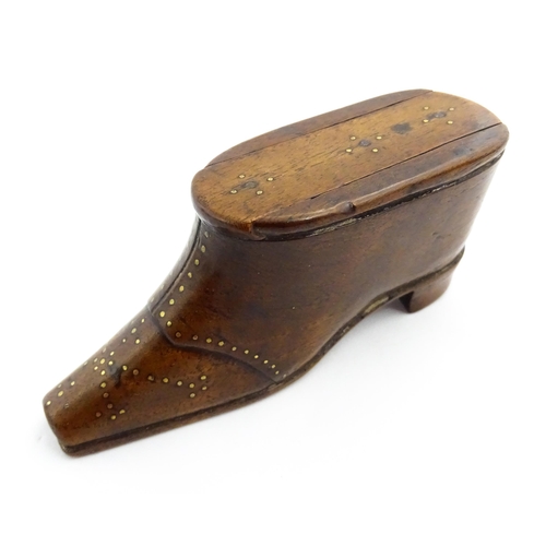 1353 - Treen : A 19thC shoe snuff box with sliding lid and inlaid brass studwork decoration. Approx. 3 3/4