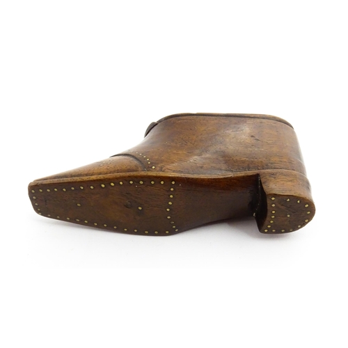 1353 - Treen : A 19thC shoe snuff box with sliding lid and inlaid brass studwork decoration. Approx. 3 3/4