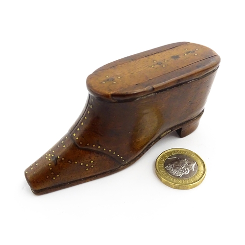 1353 - Treen : A 19thC shoe snuff box with sliding lid and inlaid brass studwork decoration. Approx. 3 3/4