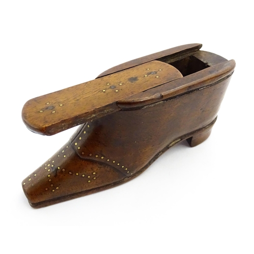 1353 - Treen : A 19thC shoe snuff box with sliding lid and inlaid brass studwork decoration. Approx. 3 3/4