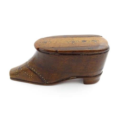 1353 - Treen : A 19thC shoe snuff box with sliding lid and inlaid brass studwork decoration. Approx. 3 3/4