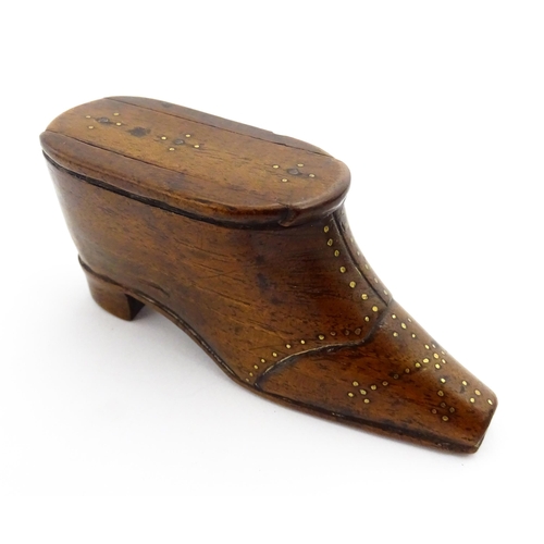 1353 - Treen : A 19thC shoe snuff box with sliding lid and inlaid brass studwork decoration. Approx. 3 3/4