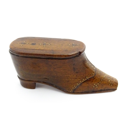 1353 - Treen : A 19thC shoe snuff box with sliding lid and inlaid brass studwork decoration. Approx. 3 3/4