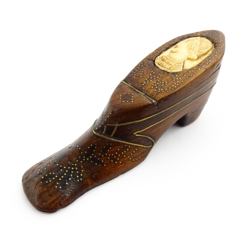 1354 - Treen : A large 19thC shoe snuff box with hinged lid and inlaid brass studwork and stringing decorat... 