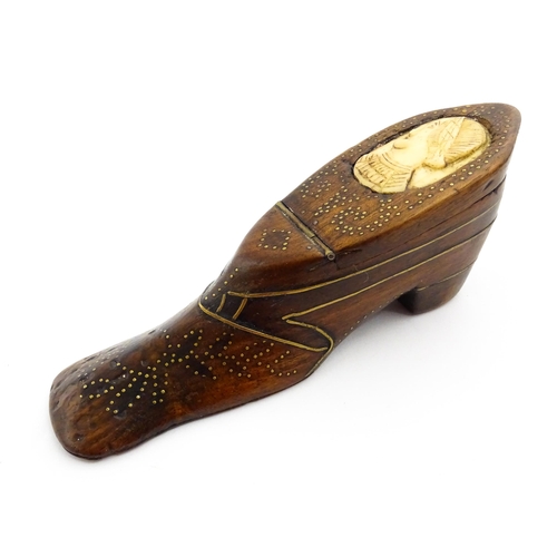 1354 - Treen : A large 19thC shoe snuff box with hinged lid and inlaid brass studwork and stringing decorat... 