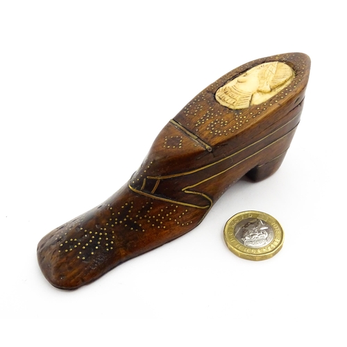 1354 - Treen : A large 19thC shoe snuff box with hinged lid and inlaid brass studwork and stringing decorat... 