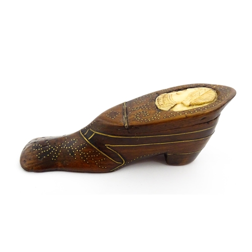 1354 - Treen : A large 19thC shoe snuff box with hinged lid and inlaid brass studwork and stringing decorat... 