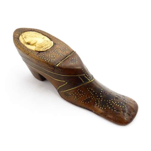 1354 - Treen : A large 19thC shoe snuff box with hinged lid and inlaid brass studwork and stringing decorat... 