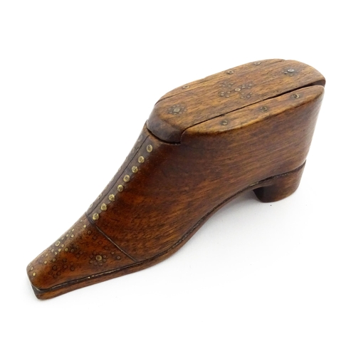 1357 - Treen : A 19thC shoe snuff box with sliding lid and inlaid brass studwork decoration. Approx. 3 3/4